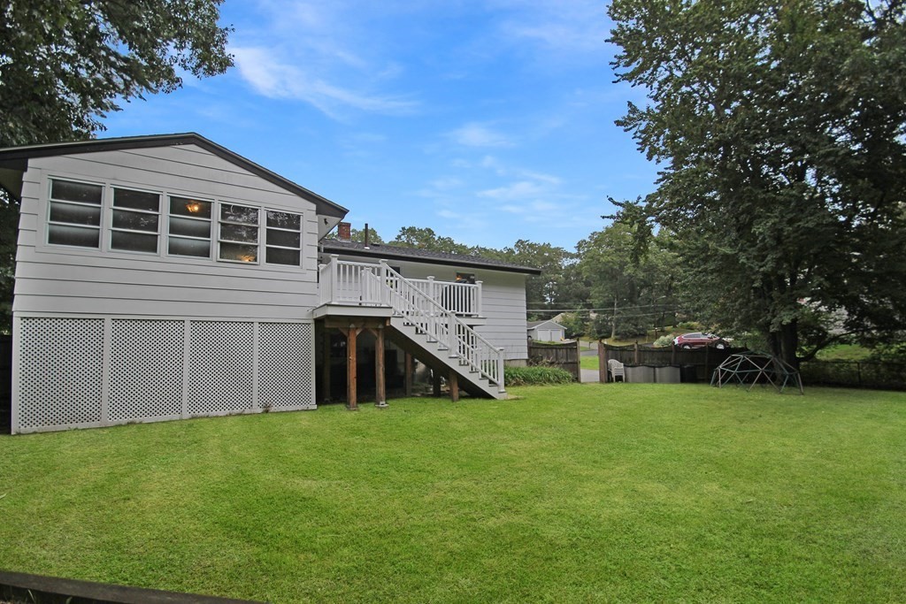 12 Prairie Road Chelmsford, MA 01824 - Photo 5 of 33 a view of a house with a backyard