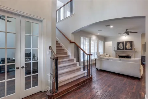 a view of a living room and entryway with wooden floor