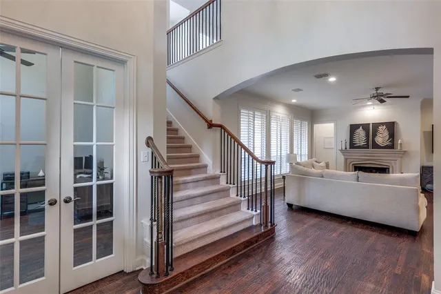 a view of a living room and entryway with wooden floor