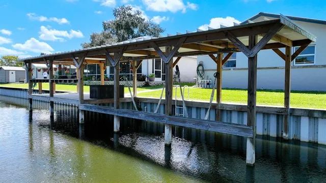 swimming pool view with a seating space