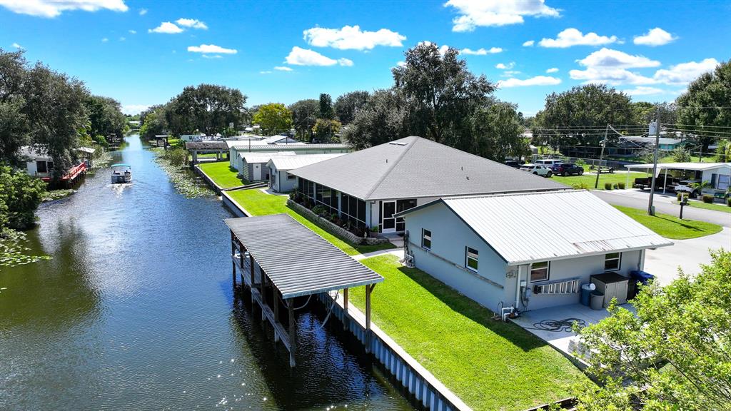 1069 9th Street Okeechobee, FL 34974 - Photo 13 of 48 an aerial view of a house with swimming pool and seating space