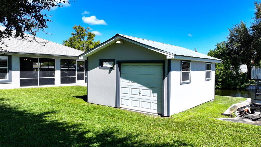 1069 9th Street Okeechobee, FL 34974 - Photo 15 of 48 a view of a house with backyard