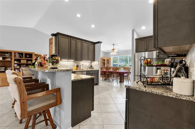 a kitchen with lots of counter top space and dining table