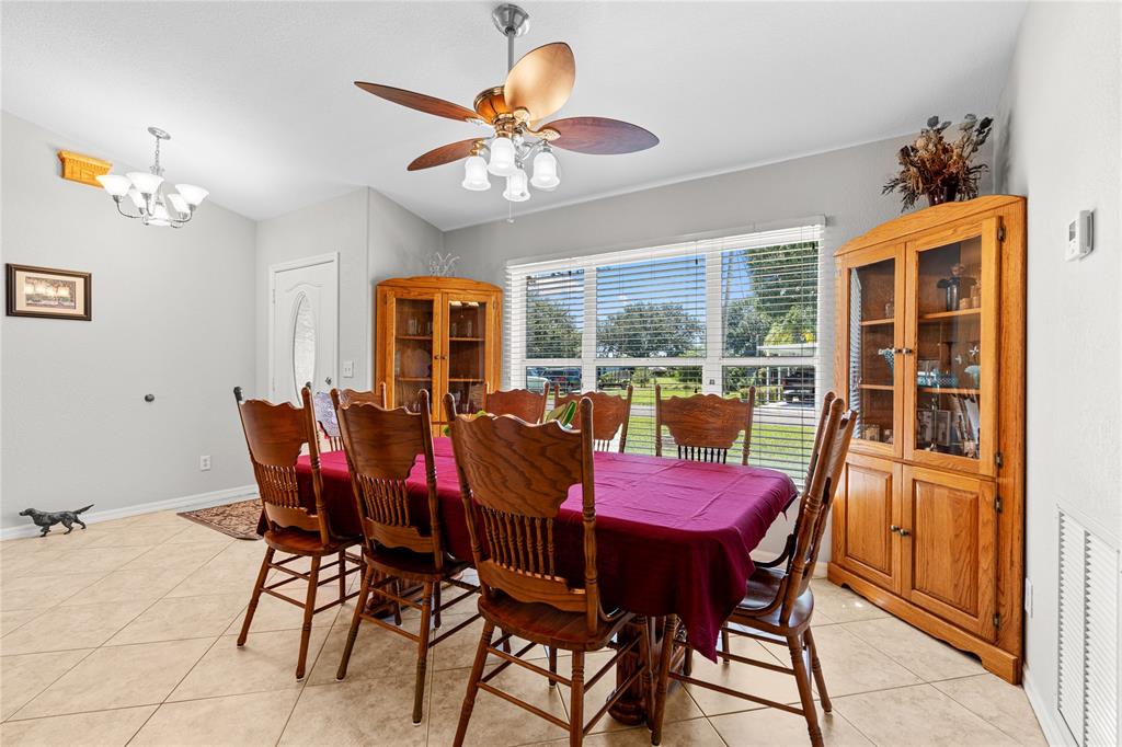 1069 9th Street Okeechobee, FL 34974 - Photo 21 of 48 a view of a dining room with furniture window and outside view