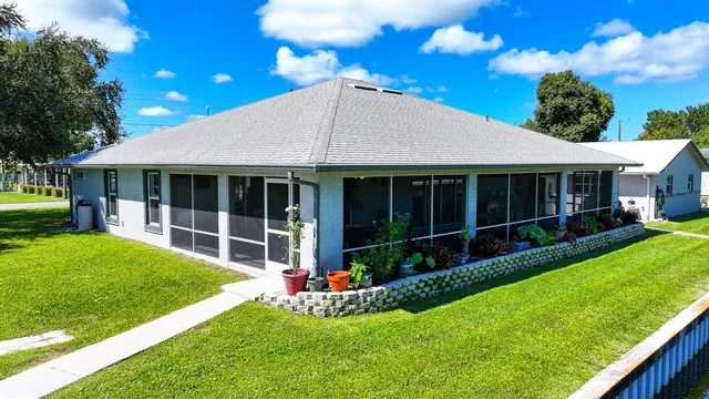 a view of an house with backyard space and porch