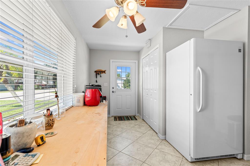 1069 9th Street Okeechobee, FL 34974 - Photo 32 of 48 a bedroom with furniture and large windows