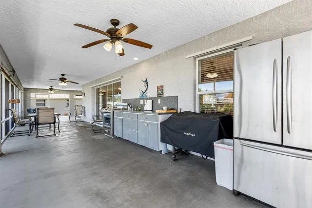 a view of a livingroom with furniture and windows