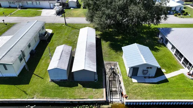 a view of a yard with chairs