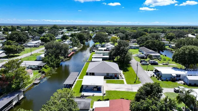 an aerial view of multiple houses with yard