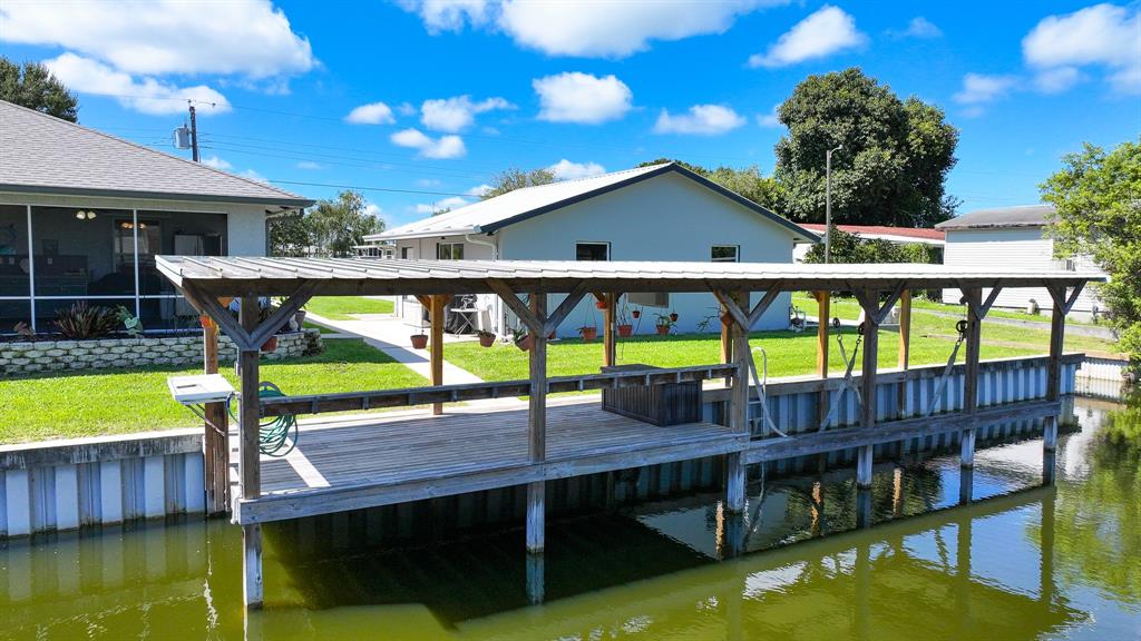 1069 9th Street Okeechobee, FL 34974 - Photo 10 of 48 a view of a swimming pool with a patio