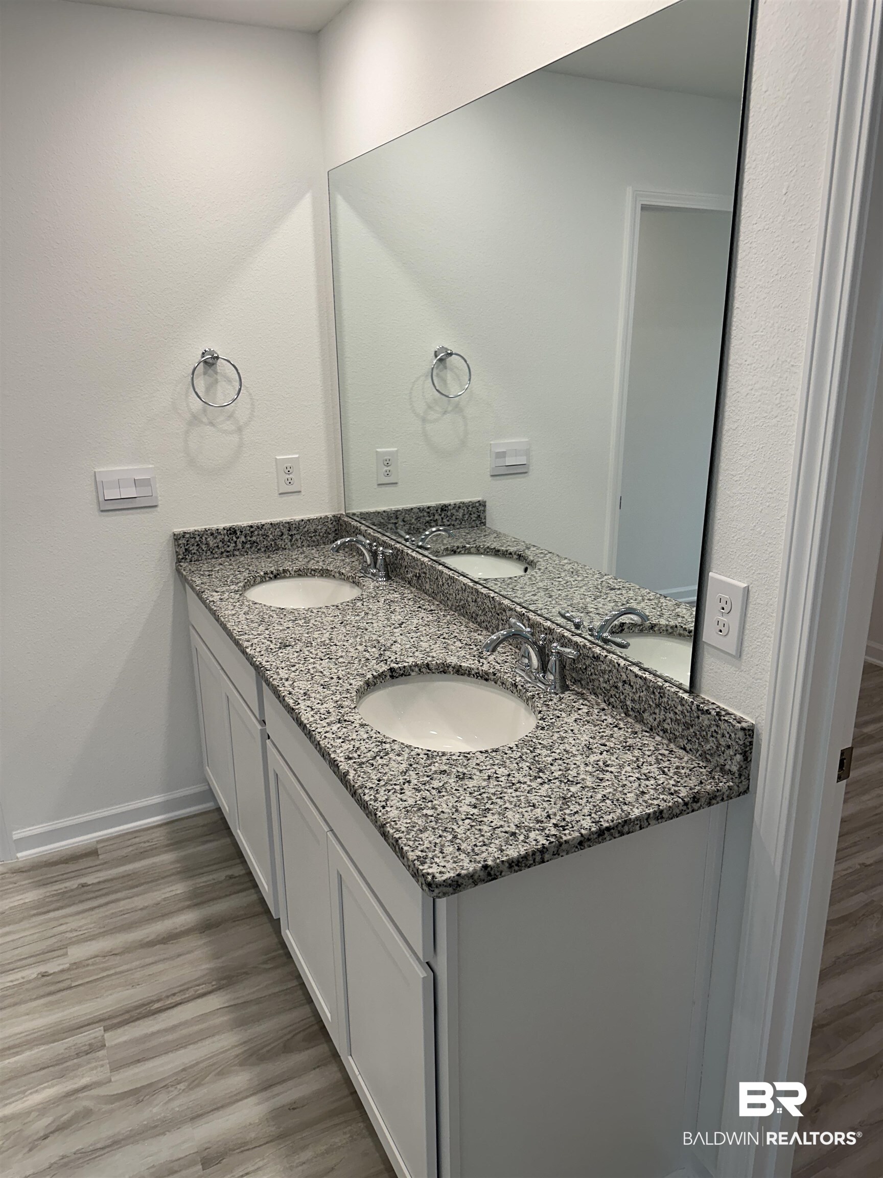22044 Aleutian Avenue Foley, AL 36535 - Photo 15 of 28 Bathroom featuring vanity and hardwood / wood-style floors