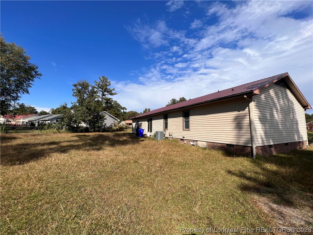 3301 Red Fox Road Spring Lake, NC 28390 - Photo 2 of 2 a backyard of a house with lots of green space
