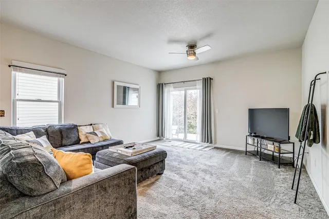 a living room with furniture and a window