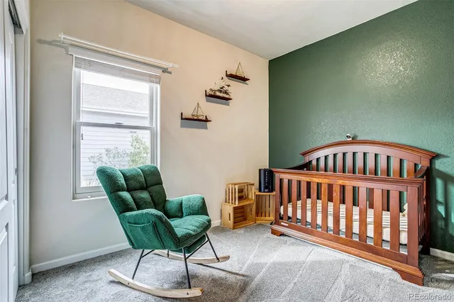 a bedroom with furniture and a window