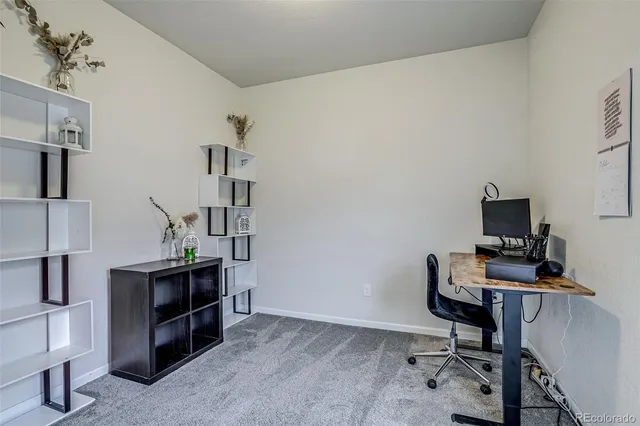 a view of a workspace with furniture