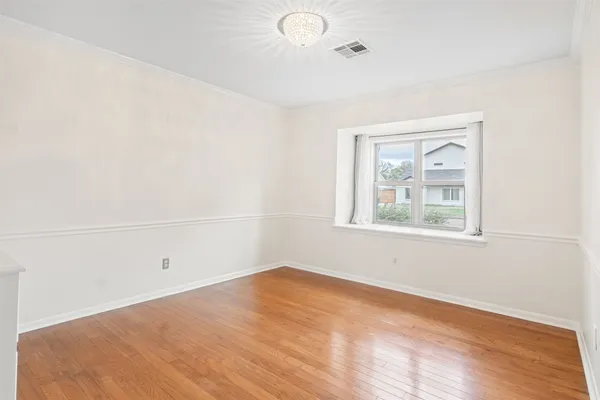 wooden floor with white walls