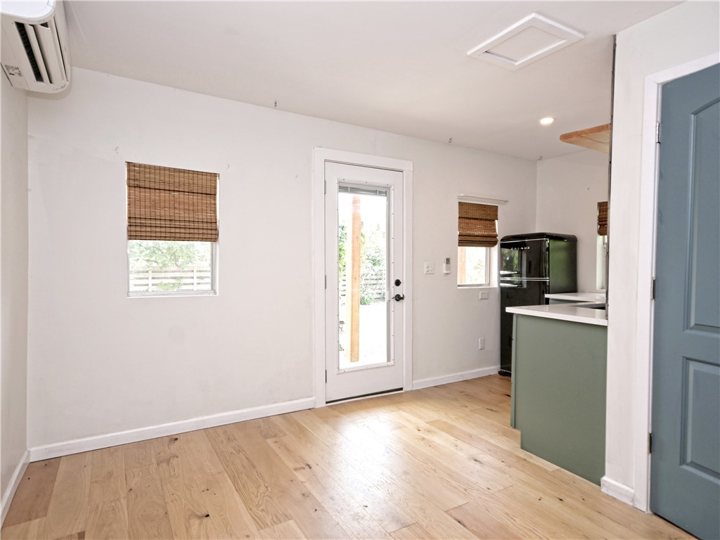 5707 Avenue F Austin, TX 78752 - Photo 14 of 17 a kitchen with a refrigerator and a stove top oven