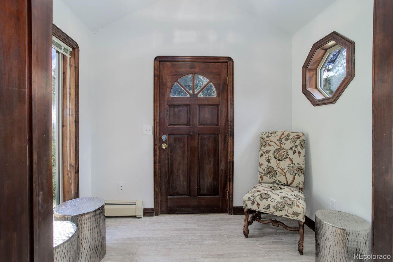 264 North Fork Road Grant, CO 80448 - Photo 12 of 34 a living room with furniture and a window