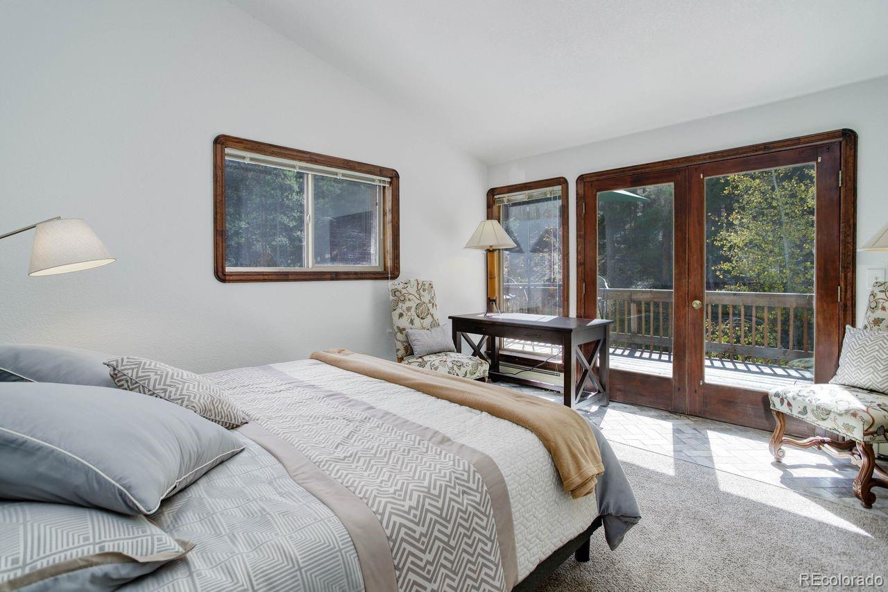 264 North Fork Road Grant, CO 80448 - Photo 13 of 34 a bedroom with a bed and a large window