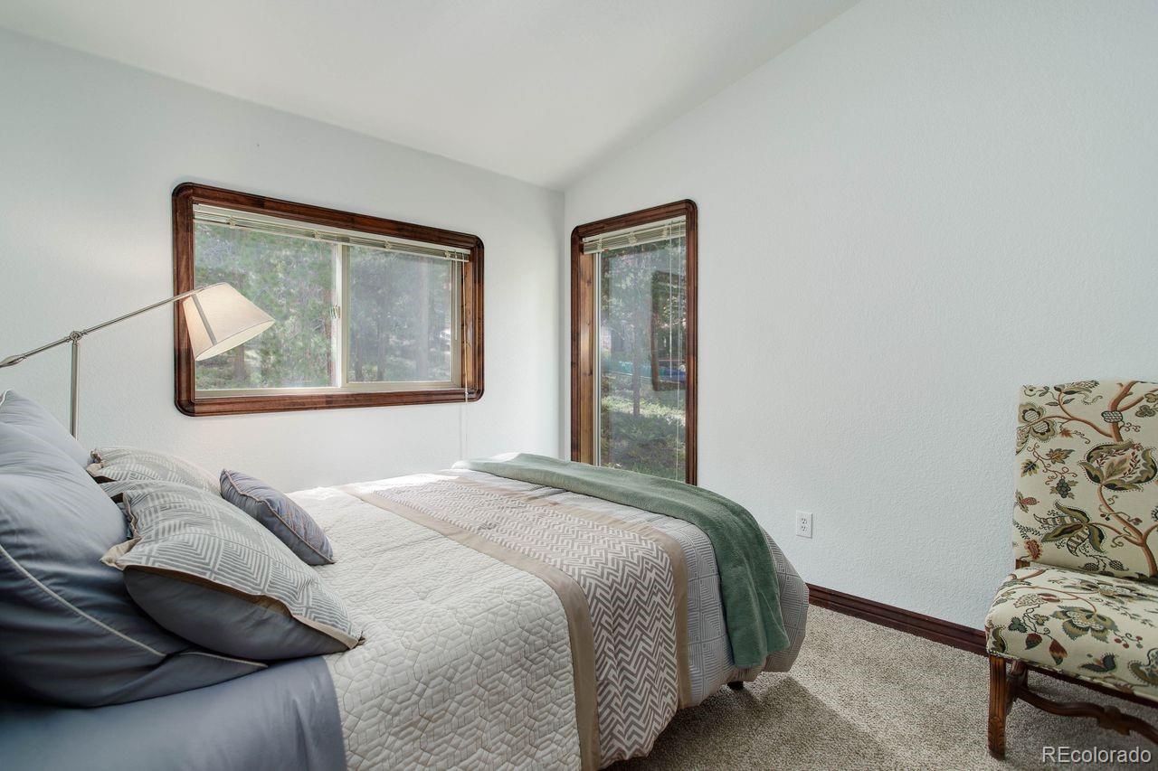 264 North Fork Road Grant, CO 80448 - Photo 19 of 34 a bedroom with a bed and a window