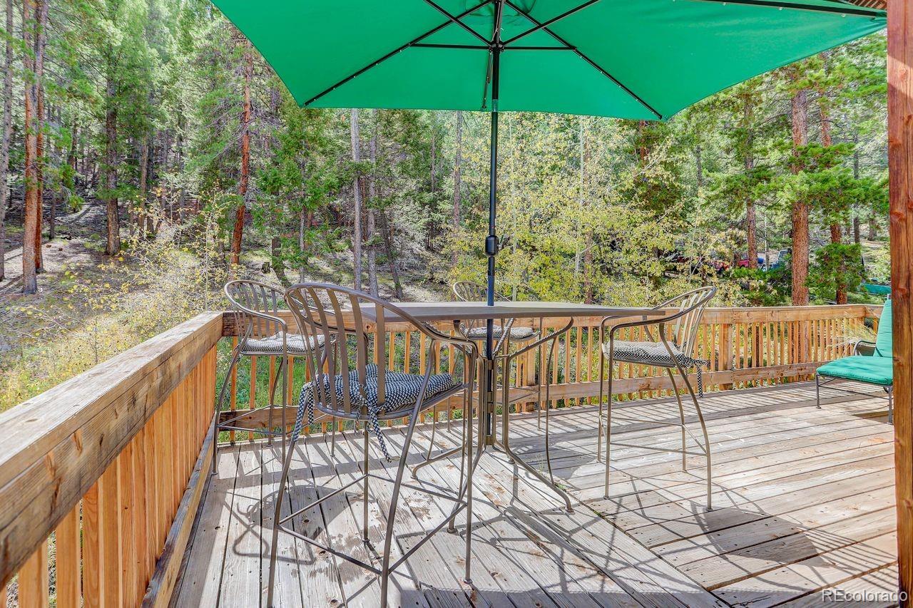 264 North Fork Road Grant, CO 80448 - Photo 26 of 34 a view of a two chairs and table in the balcony