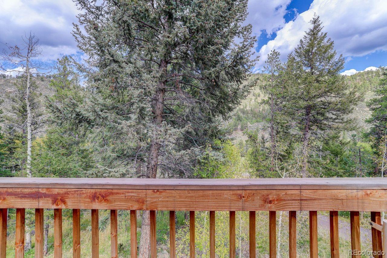 264 North Fork Road Grant, CO 80448 - Photo 34 of 34 a wooden fence with trees in the background