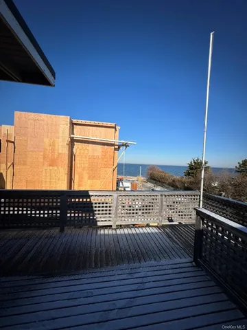 a view of balcony with wooden floor