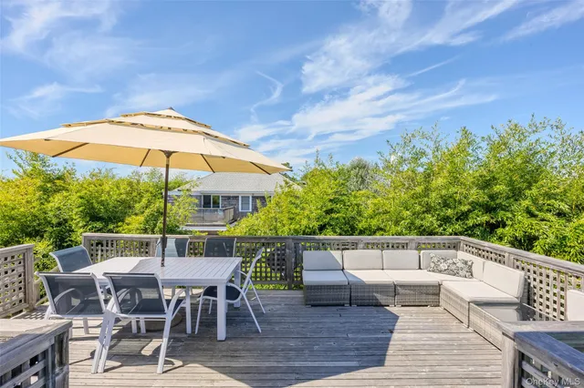 swimming pool view with a seating space