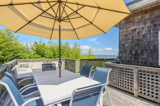 a view of balcony with furniture and outdoor