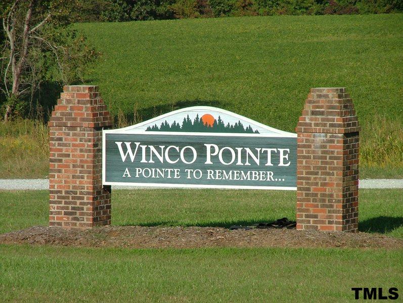 Lot 16 Winco Pointe Roxboro, NC 27574 - Photo 1 of 1 a sign of golf club on a wall next to a lake