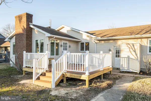 swimming pool with a bench and wooden fence