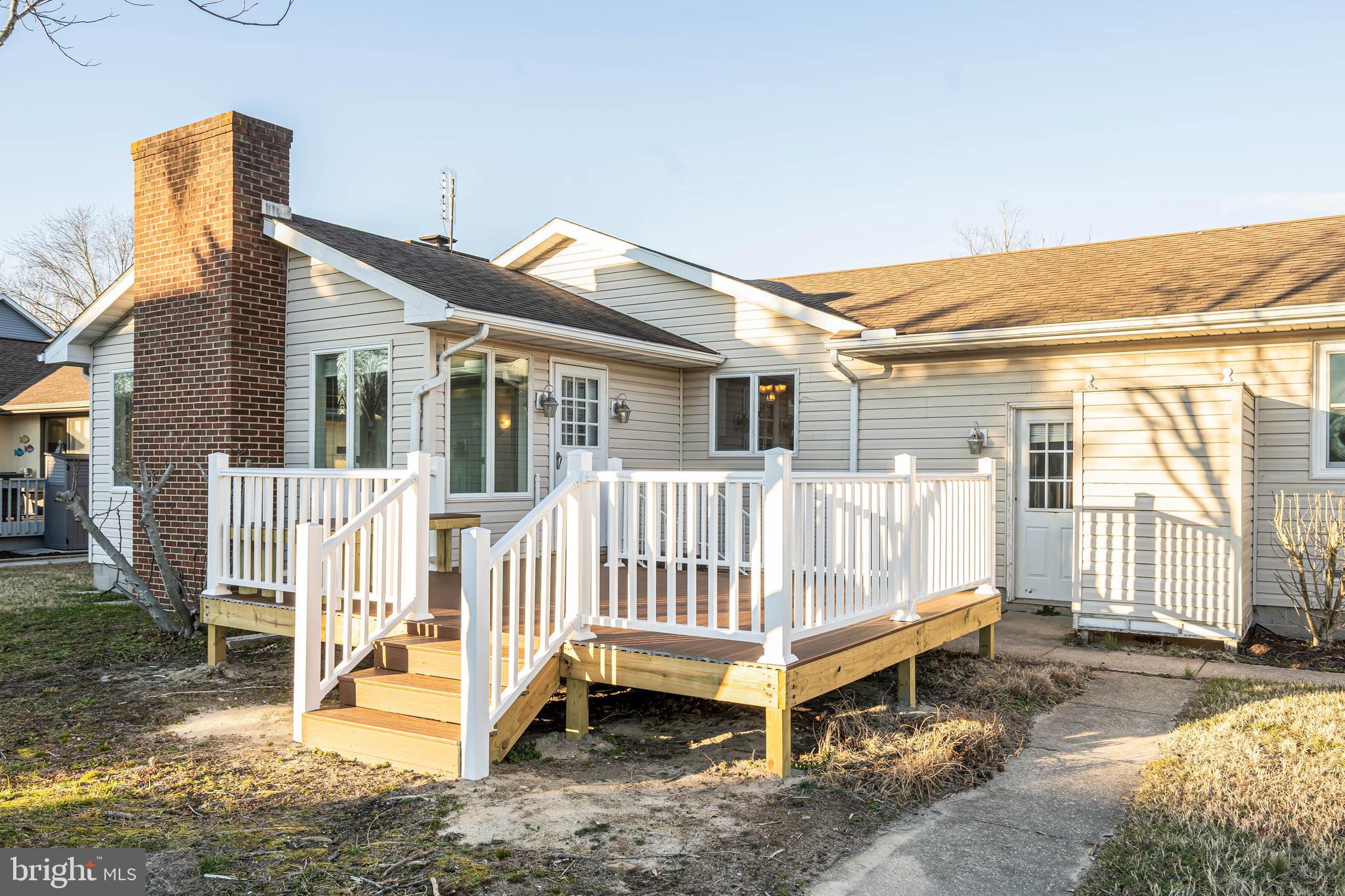 swimming pool with a bench and wooden fence