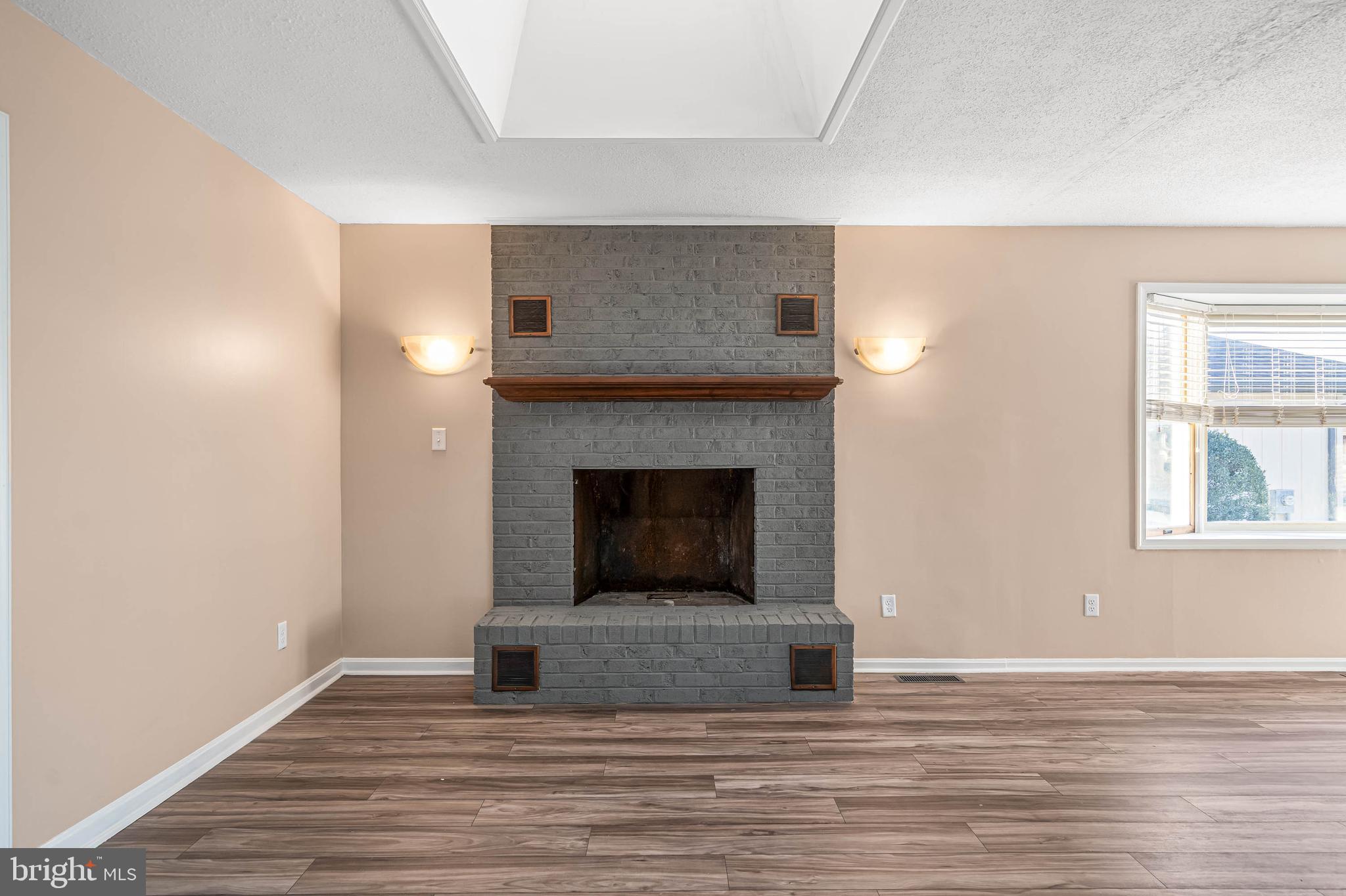 521 Harbor Road Ocean View, DE 19970 - Photo 12 of 32 a view of a livingroom with a fireplace and window