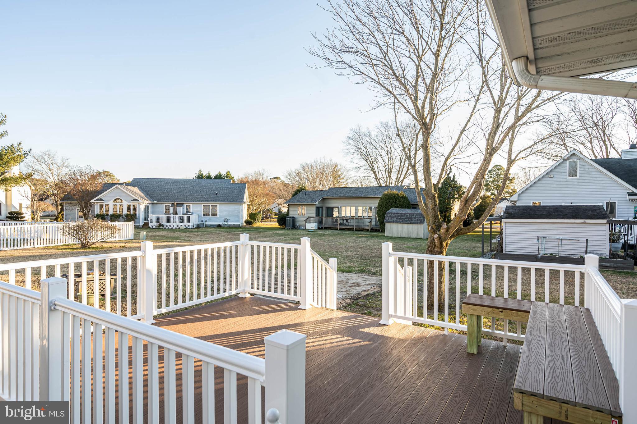 521 Harbor Road Ocean View, DE 19970 - Photo 2 of 32 a view of a deck with two chair and wooden floor