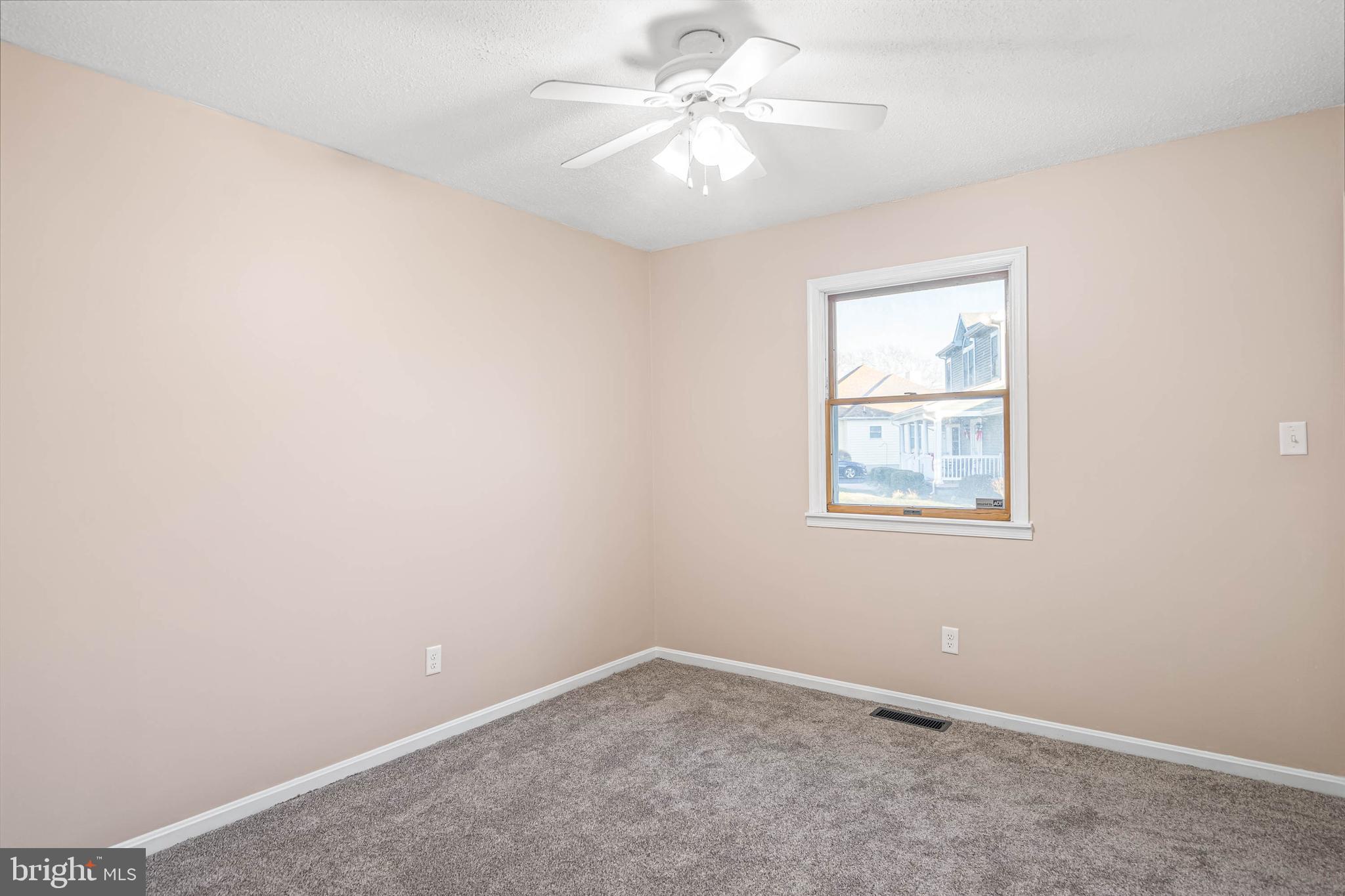 521 Harbor Road Ocean View, DE 19970 - Photo 28 of 32 an empty room with windows and fan