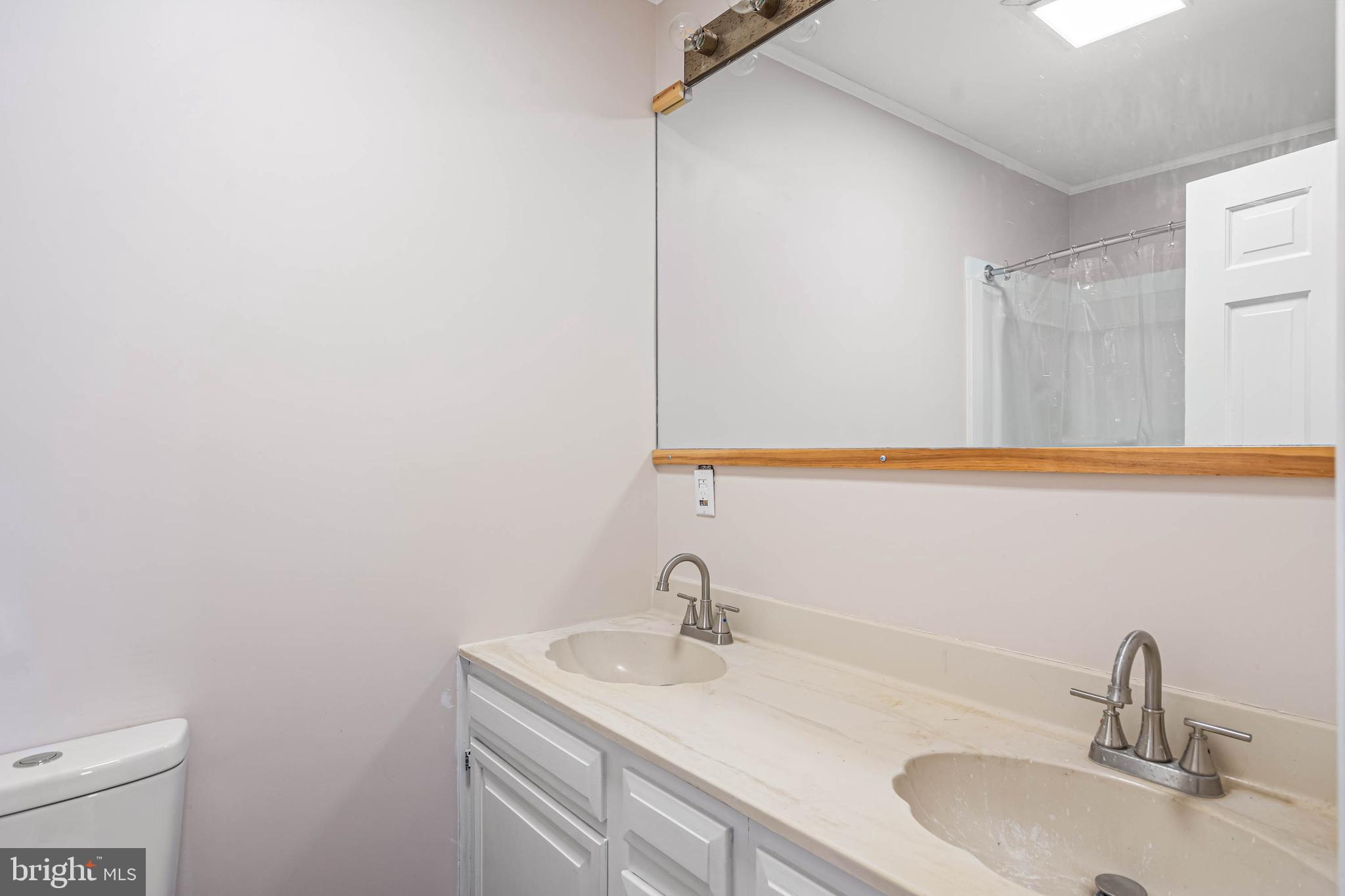 521 Harbor Road Ocean View, DE 19970 - Photo 29 of 32 a bathroom with a sink and a vanity