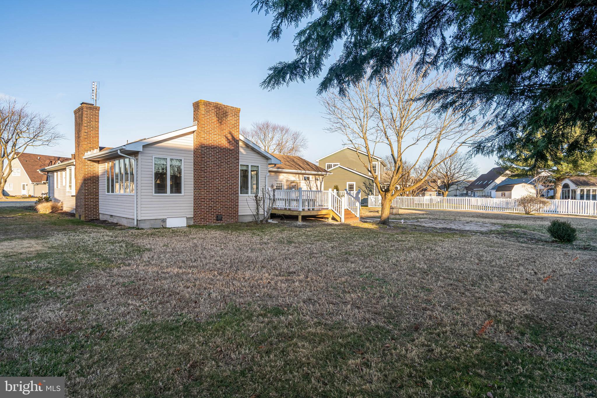 521 Harbor Road Ocean View, DE 19970 - Photo 4 of 32 a front view of a house with a yard
