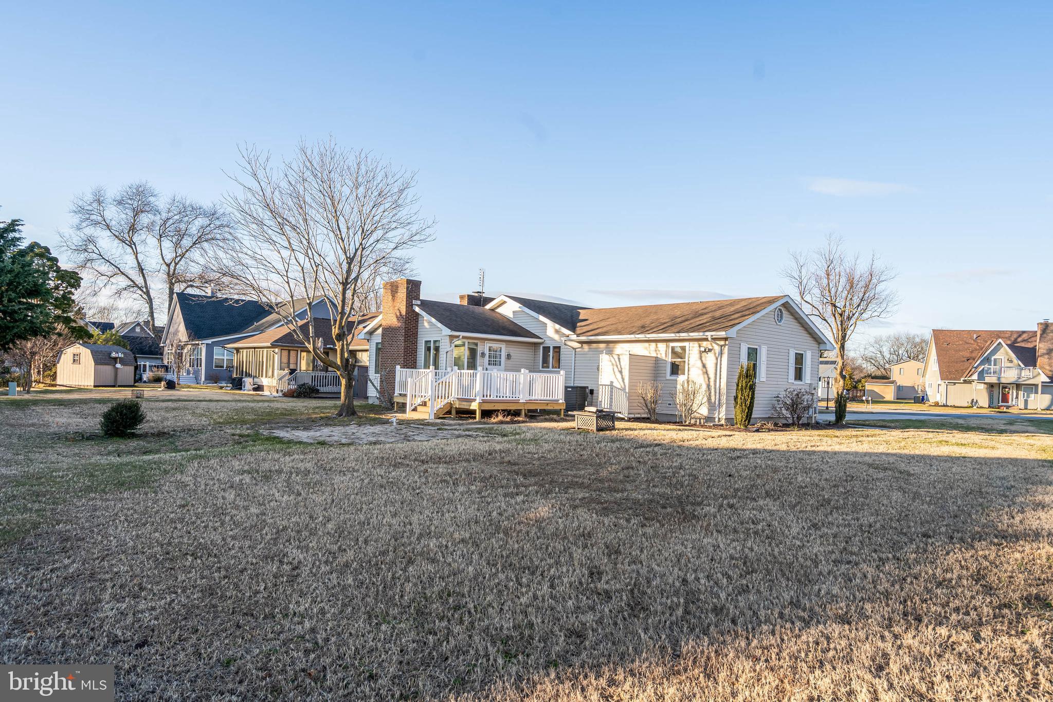 521 Harbor Road Ocean View, DE 19970 - Photo 5 of 32 a front view of a house with a yard and garage