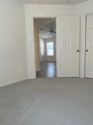 an empty room that has a window in it