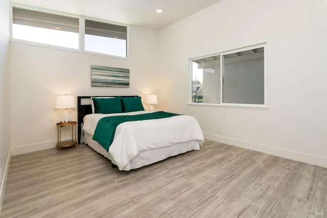 a bedroom with a bed and window