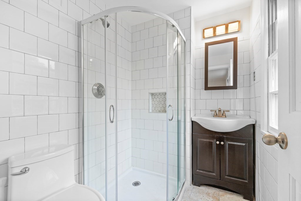 8 Sevilla Road Andover, MA 01810 - Photo 28 of 41 a bathroom with a sink a toilet and shower