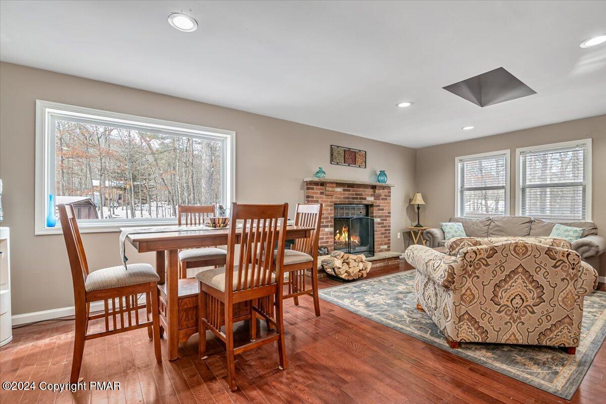 124 Rabbit Court Bushkill, PA 18324 - Photo 40 of 44 a living room with furniture a fireplace and a large window