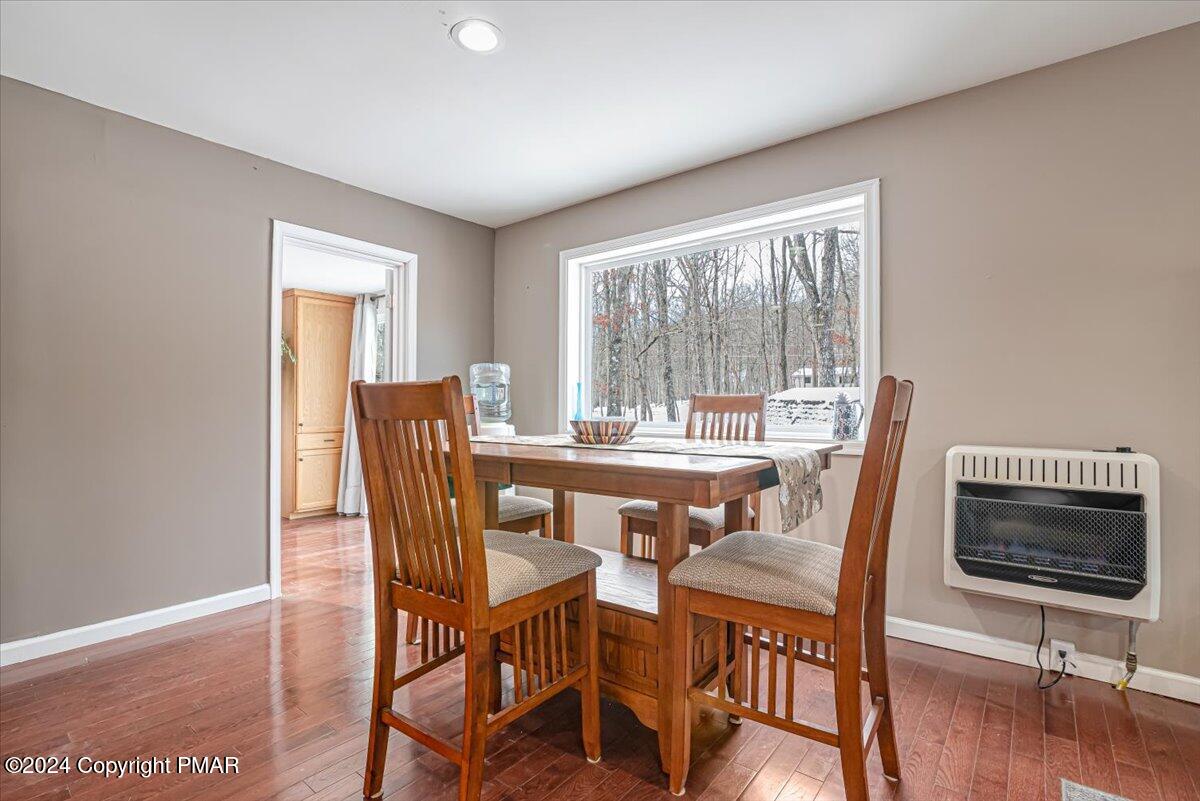 124 Rabbit Court Bushkill, PA 18324 - Photo 14 of 44 a view of a dining room with furniture window and wooden floor