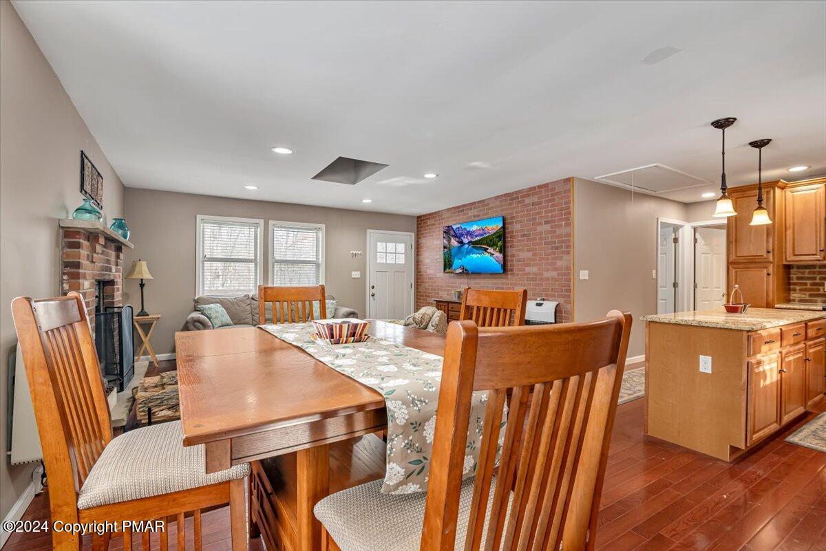 124 Rabbit Court Bushkill, PA 18324 - Photo 41 of 44 a view of a dining room with furniture window and wooden floor