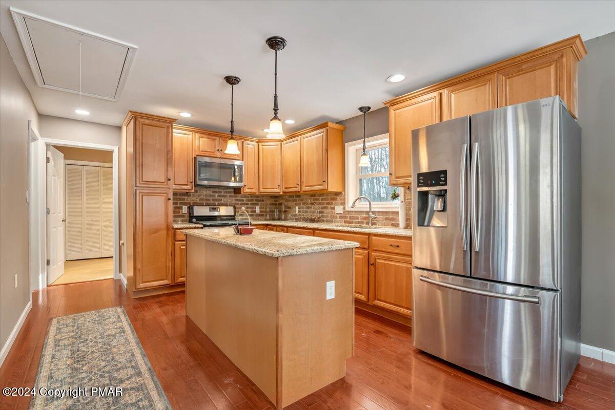 124 Rabbit Court Bushkill, PA 18324 - Photo 15 of 44 a kitchen with stainless steel appliances granite countertop a refrigerator a oven a sink and a refrigerator