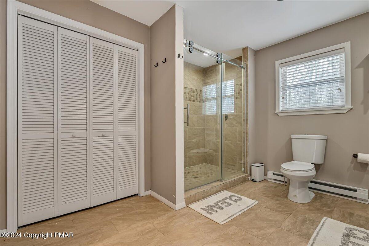 124 Rabbit Court Bushkill, PA 18324 - Photo 22 of 44 a bathroom with a toilet and a shower
