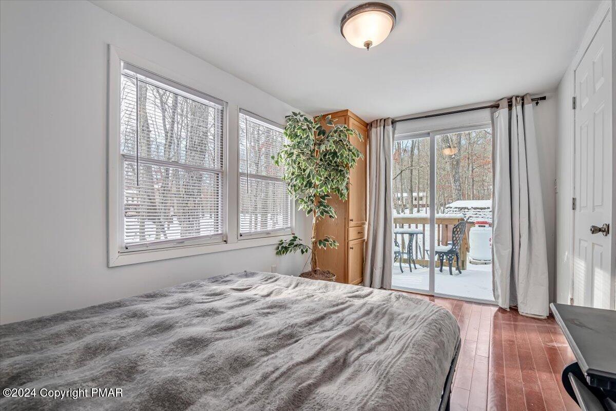 124 Rabbit Court Bushkill, PA 18324 - Photo 25 of 44 a bedroom with a bed and a large window with outer view