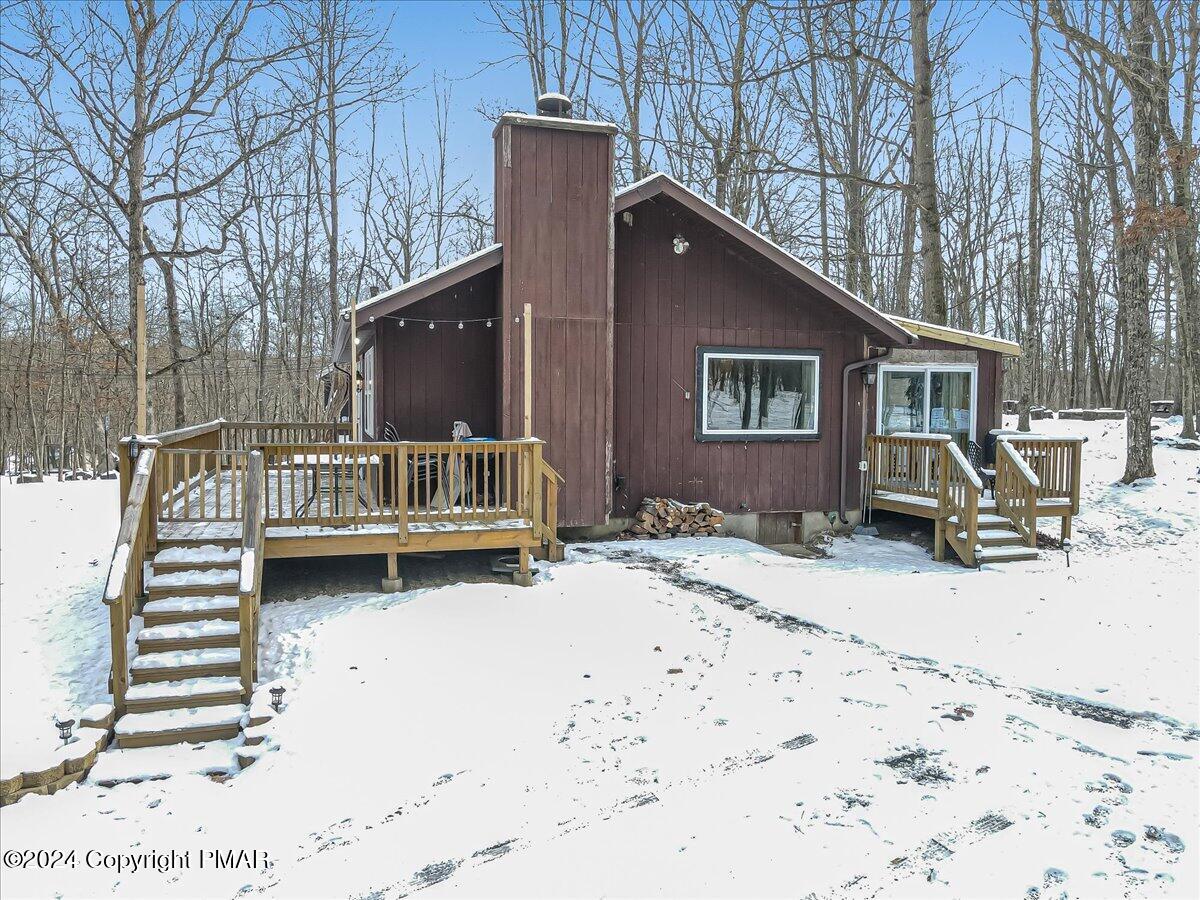 124 Rabbit Court Bushkill, PA 18324 - Photo 27 of 44 a view of a house with a yard covered in snow