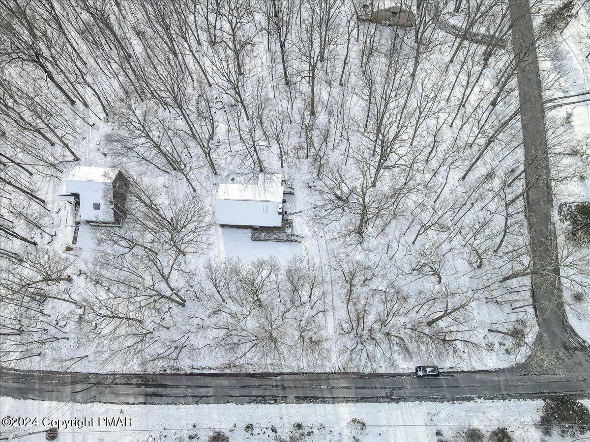 124 Rabbit Court Bushkill, PA 18324 - Photo 34 of 44 a wooden bench sitting in the middle of a yard