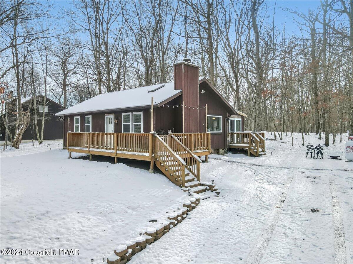 124 Rabbit Court Bushkill, PA 18324 - Photo 5 of 44 a view of a house with a yard covered in snow